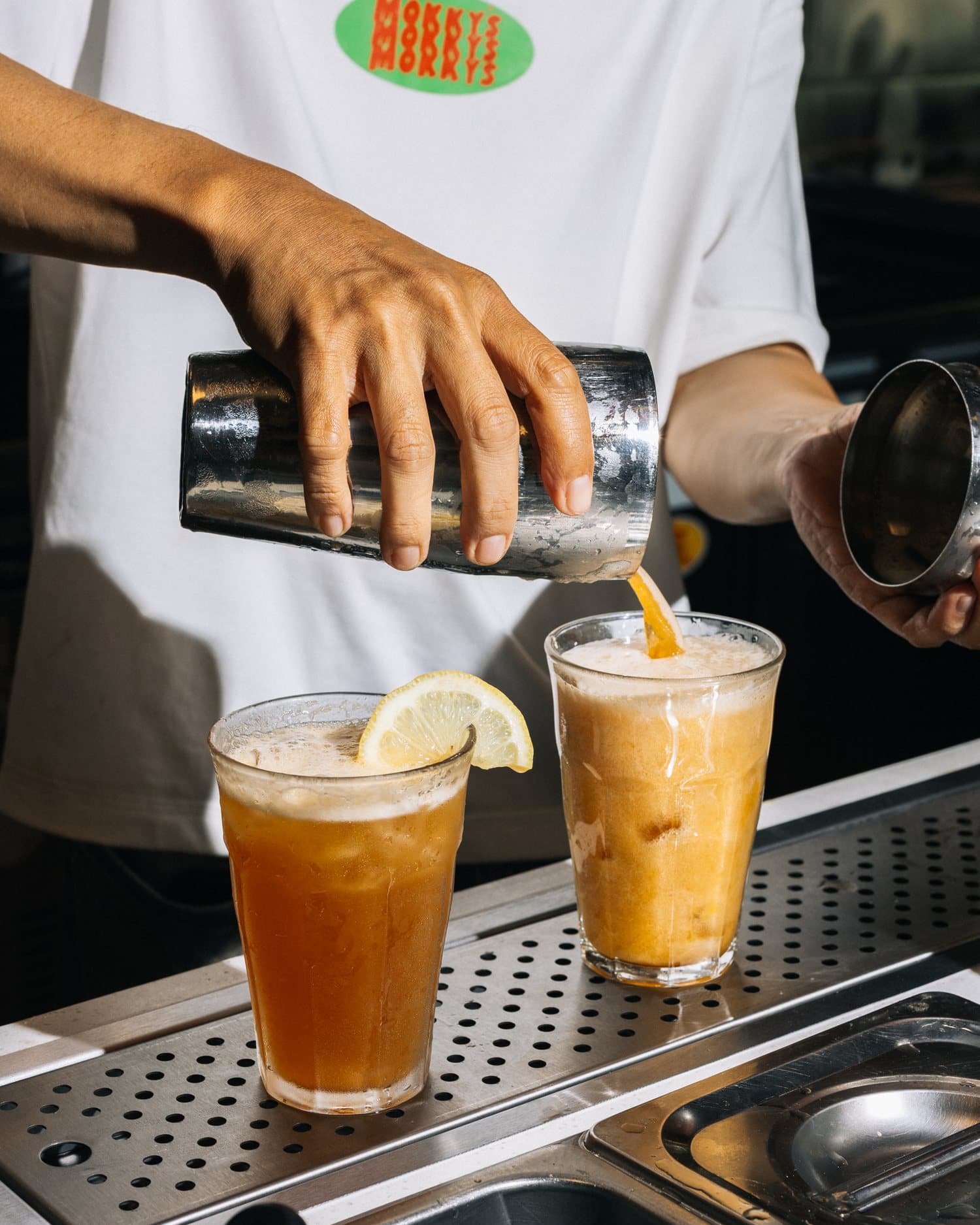 Pouring iced drinks behind the bar