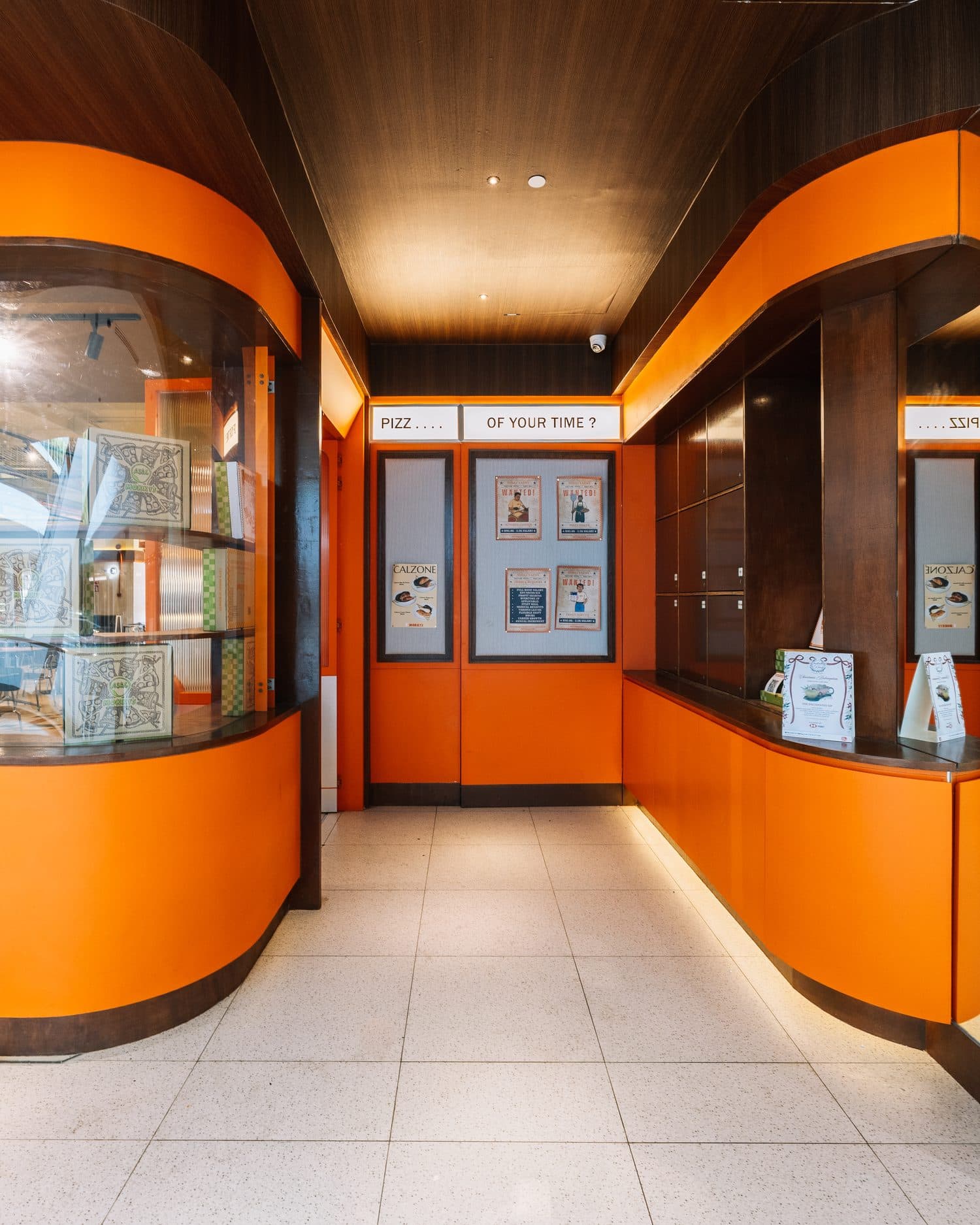 Inside a Mokky's outlet: orange counters and a terrazzo floor